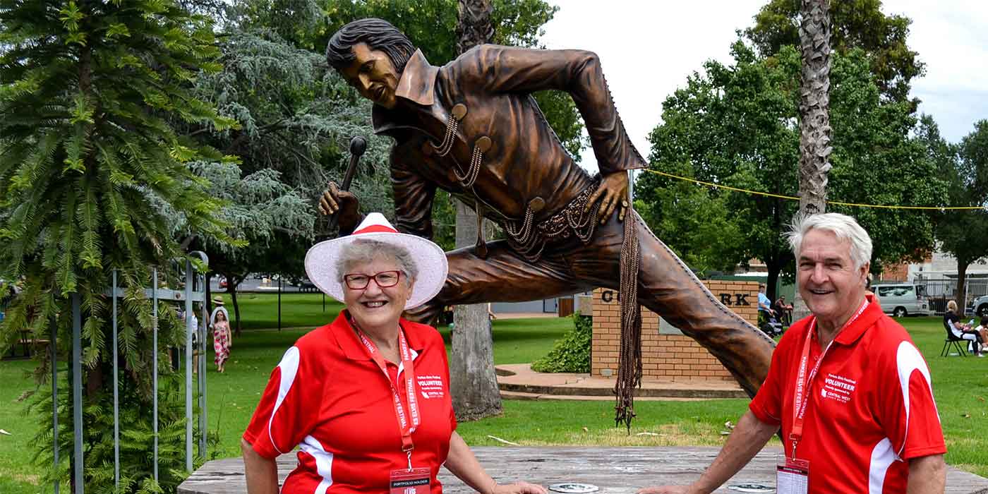 Parkes Elvis Festival Founders, Bob and Anne Steel at the Elvis Statue in Cooke Park